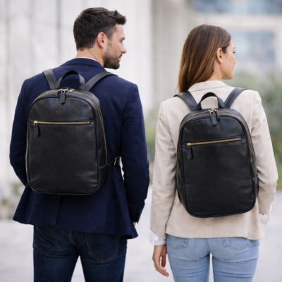 גבר ואישה עם תיק גב מעור שחור יוניסקס, עיצוב אלגנטי, מתאים לעבודה וליום-יום